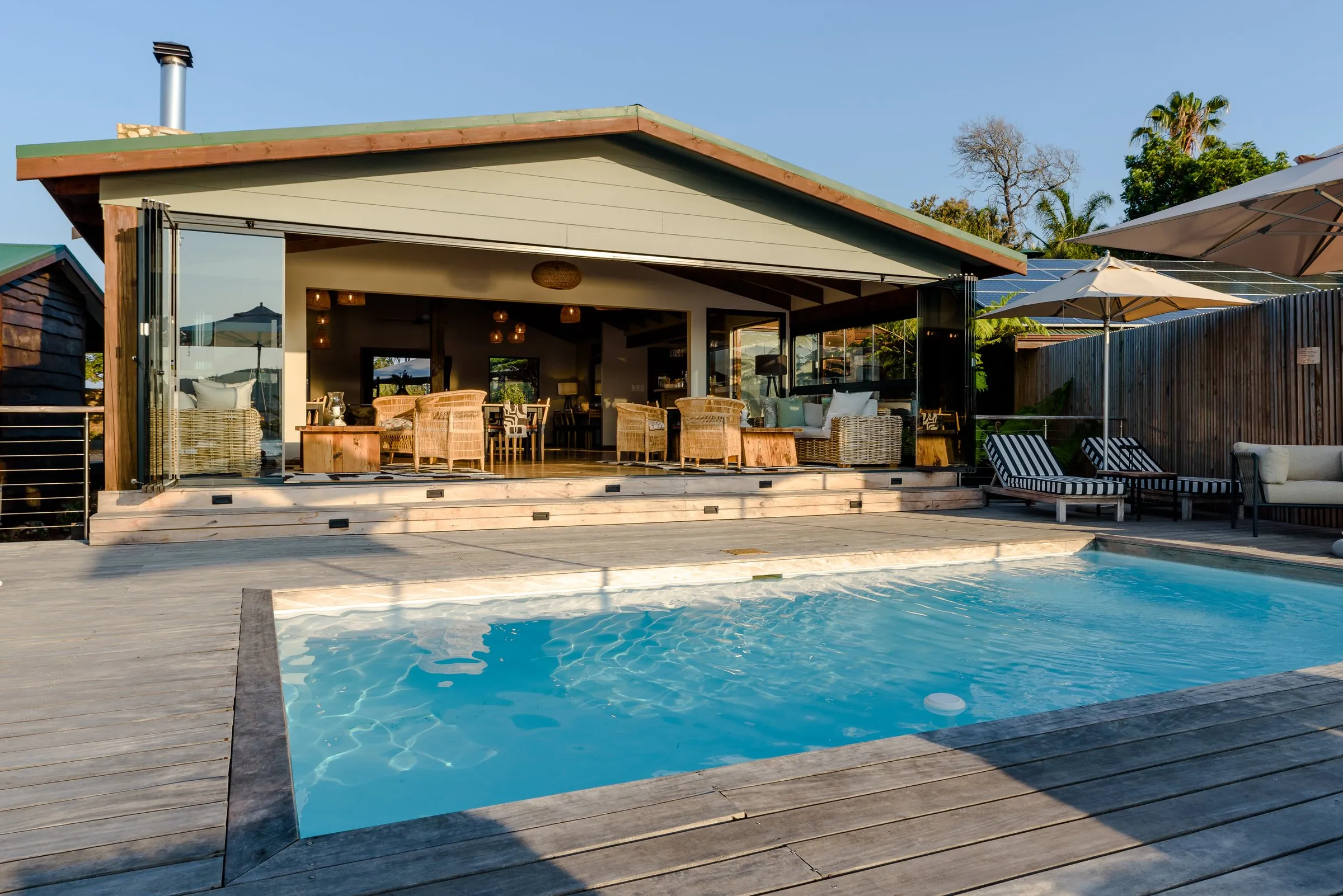 The pool and deck in front of the main lodge