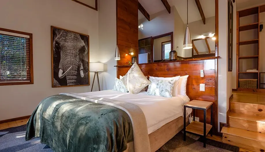 Executive Suite bedroom with an elephant portrait above the bed