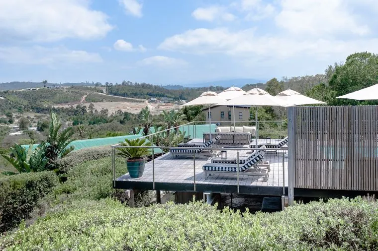 The view down over the gardens to the pool deck and the lagoon