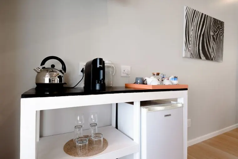Coffee machine, kettle and mini fridge at the refreshment station