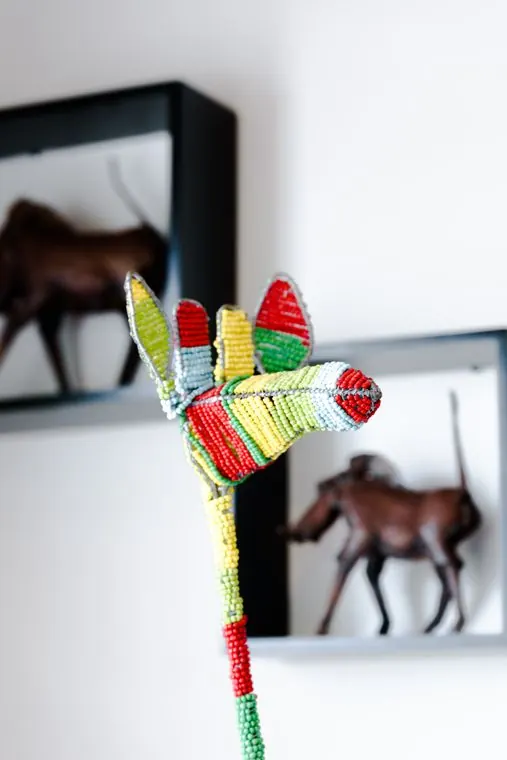 A beaded bird on the shelf