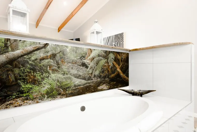 The bath and the forest mural from the doorway