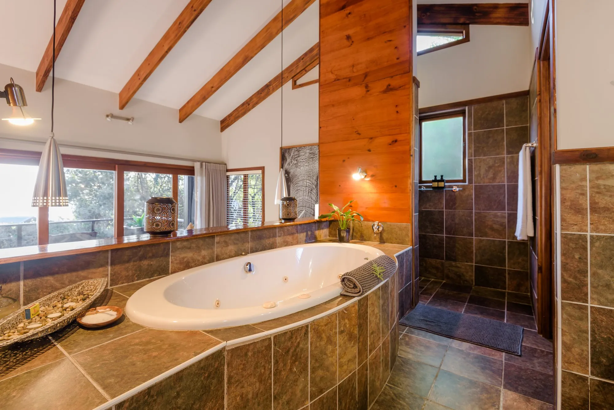 Spa bath set in slate beneath the windows
