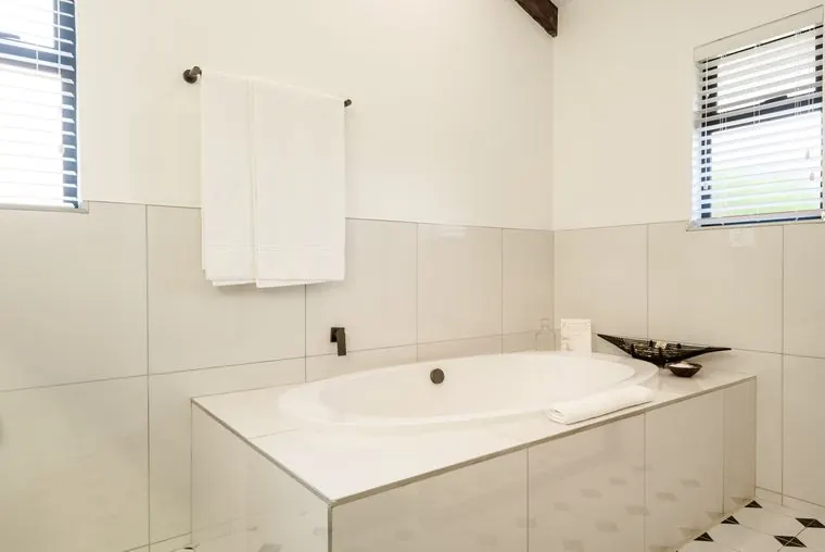 The bath beneath a window