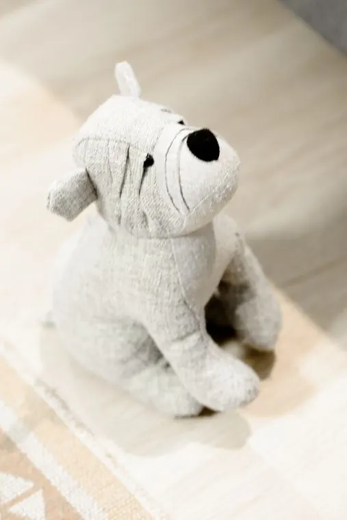 A knitted toy dog