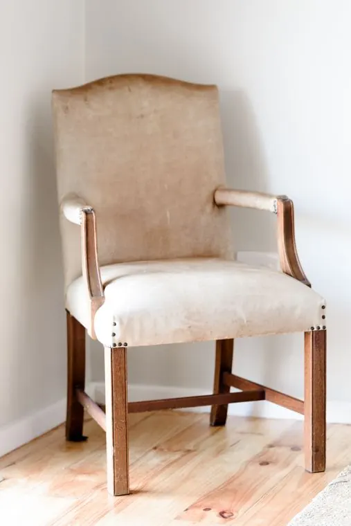 An upholstered armchair in the corner