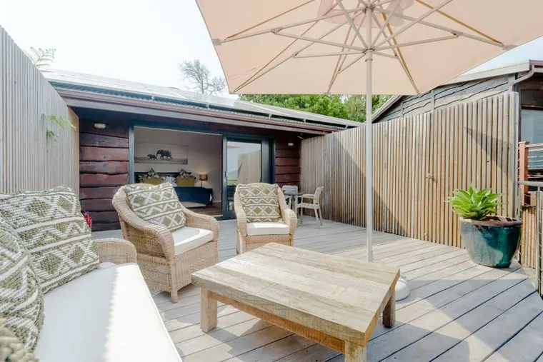 The deck lounge under a sun umbrella